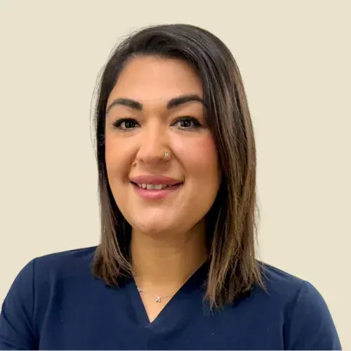 Expert female hair restoration specialist at ROG Hair Institute with professional attire.