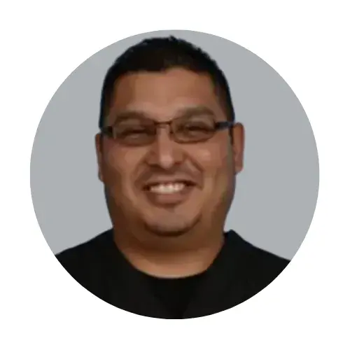 Expert hair restoration specialist at ROG Hair Institute smiling confidently.